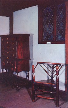 This postcard image shows antique furniture at the Paul Revere House in Boston, MA, specifically a coat tail chair and highboy.  The original unused card is for sale in The unltd.com Store.